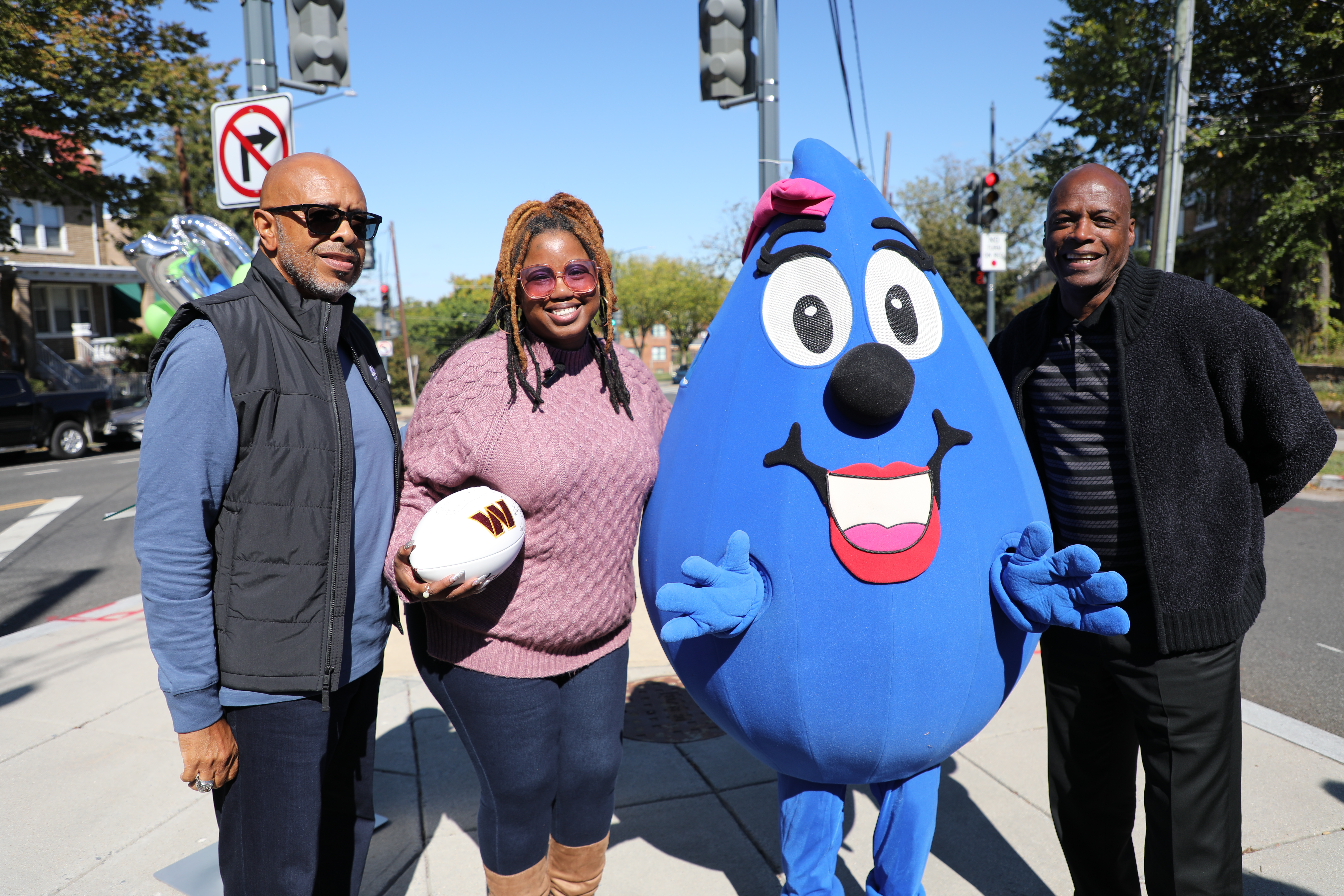 Ms. Gartrell received a signed football from Mr. Green and DC Water memorabilia during this special moment for DC Water and the community.