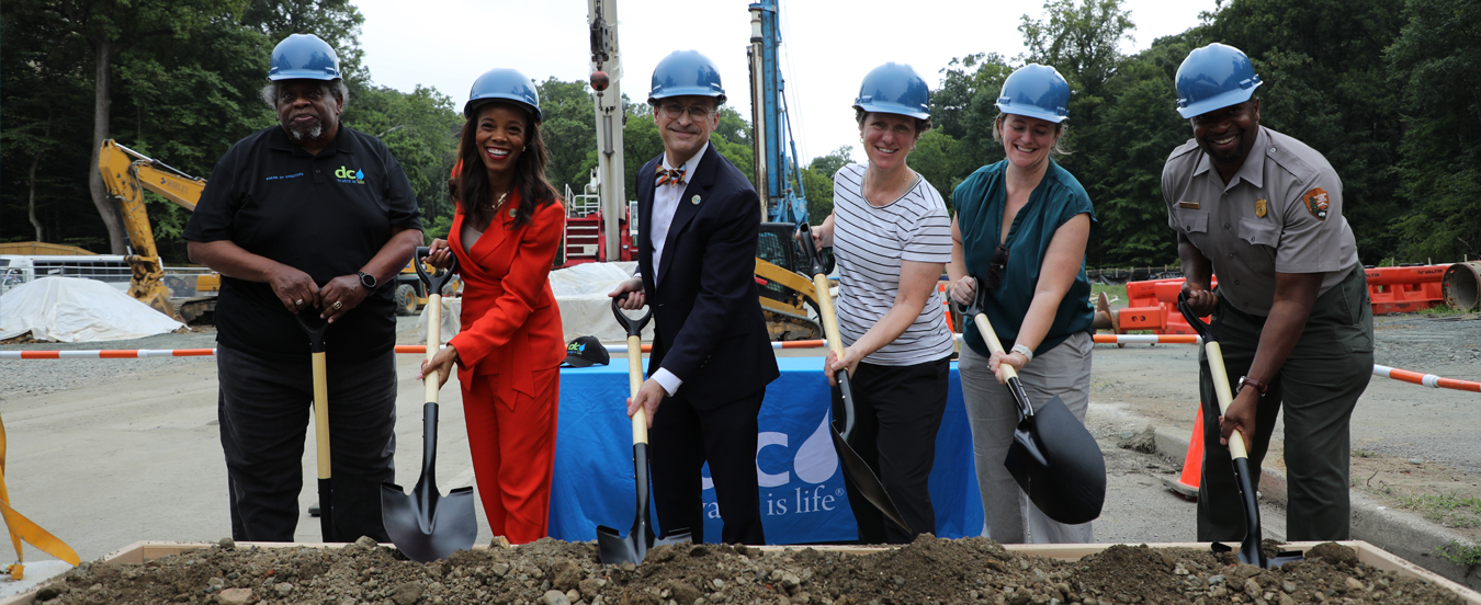 Officials pause for a photo during the groundbreaking