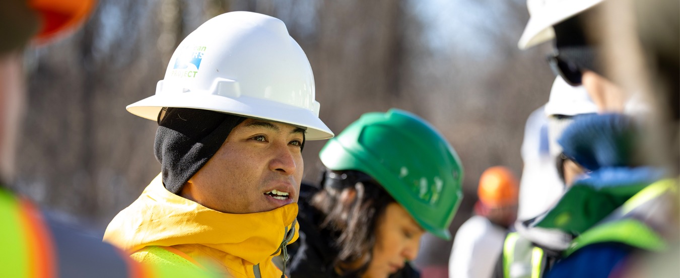A project manager briefs District and Maryland officials about work at the site