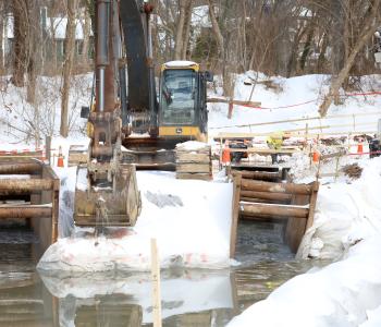 Photo of equipment and workers manning the PI bypass return