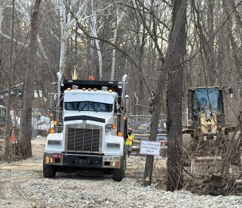Photo of trucks and construction at downstream location working on the enhanced bypass pumping system