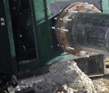 Image of pump with a large pile of wipes next to it that clogged the pump and had to be removed