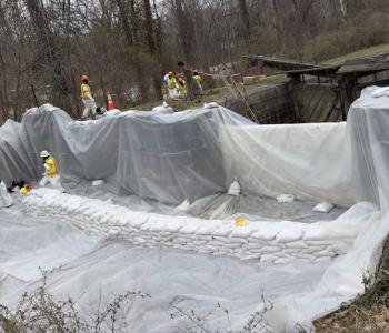 Workers constructing the freshwater dam to be used for flushing the C & O Canal