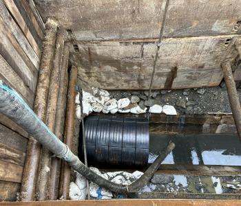 Protective Encasement for workers to apply the geopolymer lining