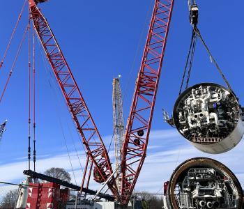 The shields for the tunnel boring machine Mary being lowered by cranes into the shaft