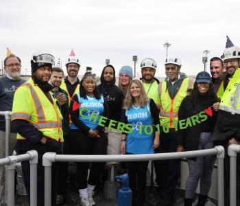 Photo of Bloom and Blue Drop staff celebrating 10 years of Bloom at Blue Plains