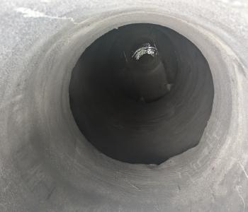 Photo of manhole entrance withe completed geopolymer