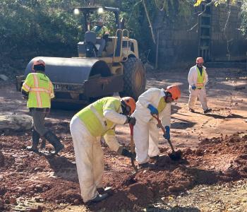 Compact Roller and workers working on the C & O Canal clay liner