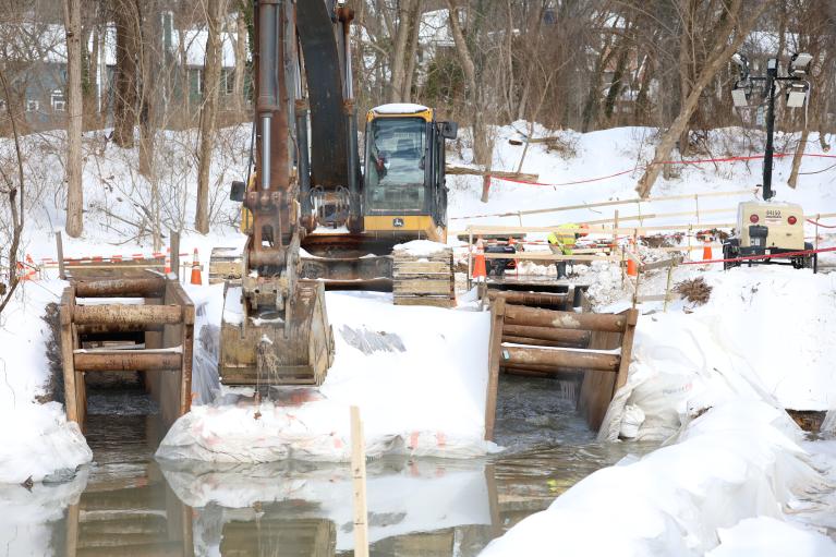 Photo of equipment and workers manning the PI bypass return