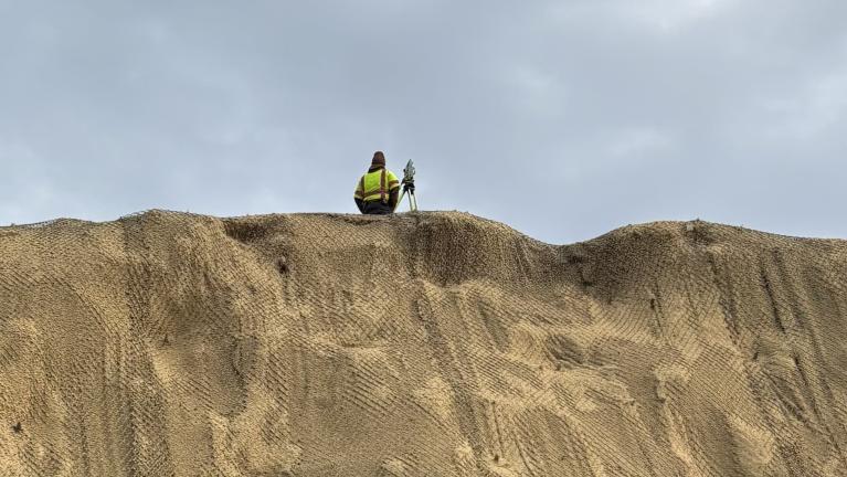 Picture of survey worker at the top of the hill off Canal Road