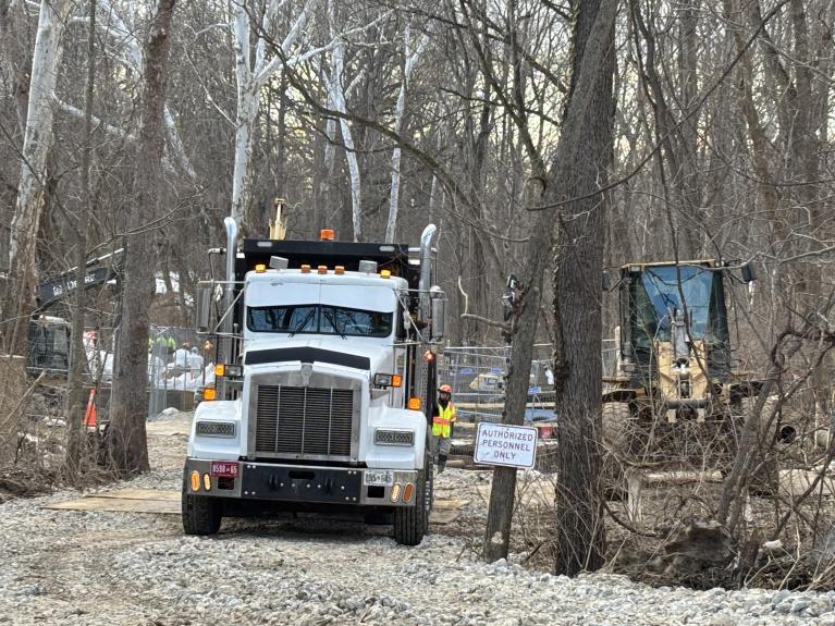 Photo of trucks and construction at downstream location working on the enhanced bypass pumping system