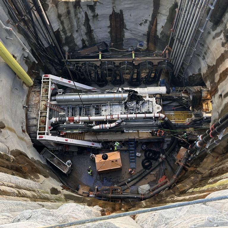View of Mary at bottom of shaft inside tunnel shown from above