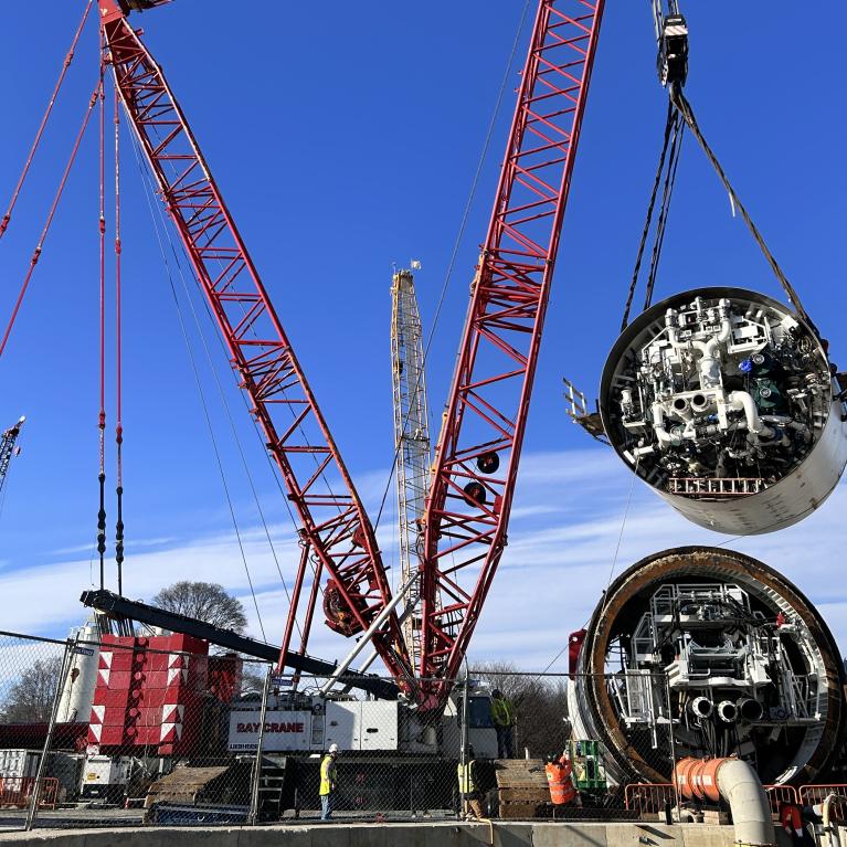 The shields for the tunnel boring machine Mary being lowered by cranes into the shaft