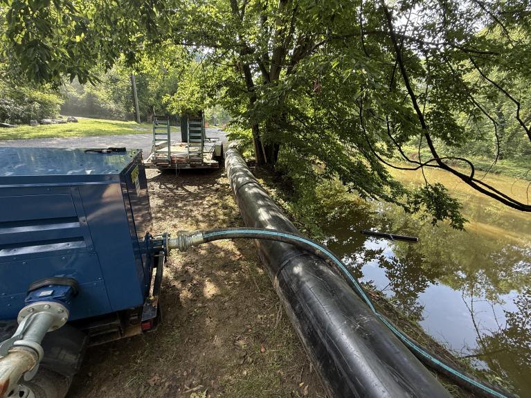 Pennyfield Lock Potomac Interceptor bypass pipeline running next to C & O Canal with equipment