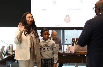 Dr. Unique N. Morris-Hughes swearing in as Board Chair Dr. Unique N. Morris-Hughes being sworn in at the Board of Directors Meeting