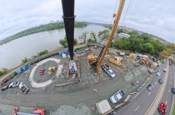Aerial View of Construction near Watergate Complex Shows cranes and construction of drop shaft underway