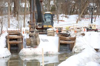 Photo of equipment and workers manning the PI bypass return