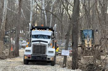 Photo of trucks and construction at downstream location working on the enhanced bypass pumping system