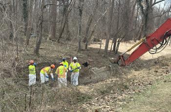 Photo of workers doing environmental rehab in west section of Area 1