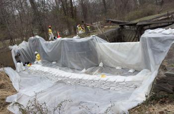 Workers constructing the freshwater dam to be used for flushing the C & O Canal