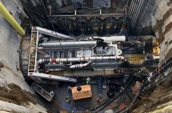 View of Mary at bottom of shaft inside tunnel shown from above